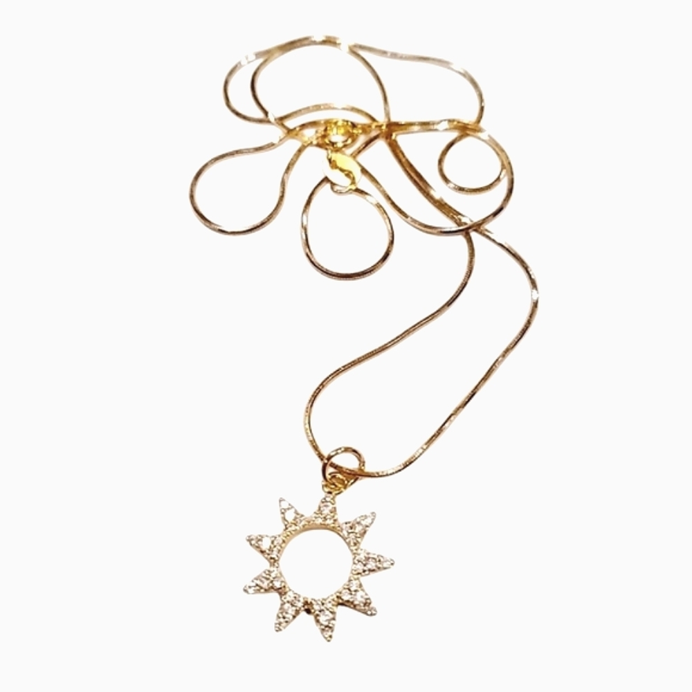 Sunburst zirconia pendant on an 18 inch gold plated copper snake chain; NWOT